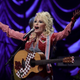 You can trust Dolly on this; she even has a flower painted on her guitar.